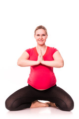 Fototapeta premium Pregnant woman exercising isolated on white