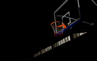 Basketball hoop on  black background with light effect