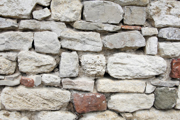 solid stone wall that is the basis for ancient wall