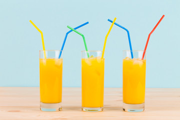 Orange juice on wooden table.