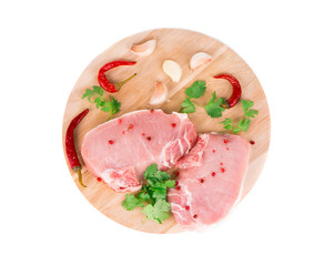 Raw meat on a wooden platter.