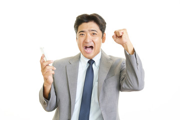 ガッツポーズのビジネスマン
