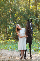 Fototapeta premium Cute woman with horse