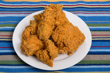 Five Pieces of Fried Chicken on Striped Placemat