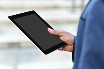 Business man holding a digital tablet