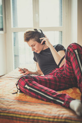 young lesbian stylish hair style woman listening to music