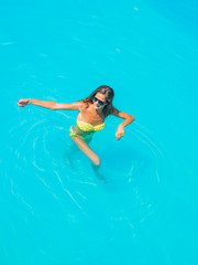 woman in bikini at the swimming pool