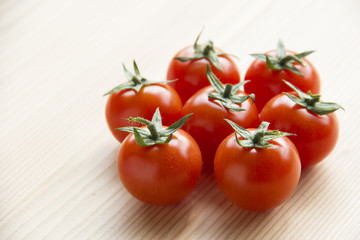 Tomatoes on wooden table