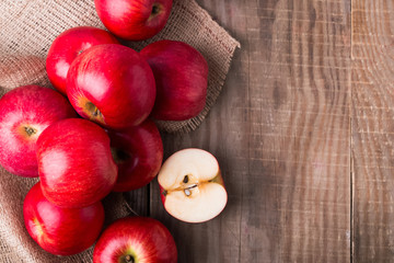 Red apples on the wooden table