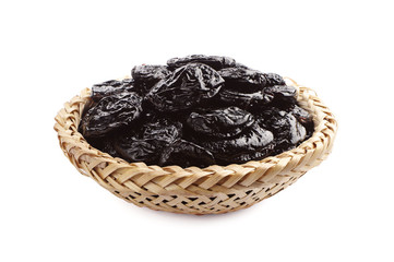 Dried plum in wicker bowl