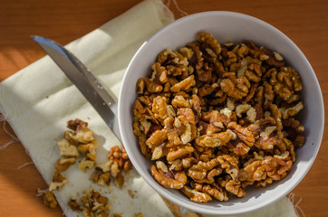 walnut on the board on the table with knife