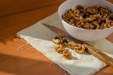 walnut on the board on the table with knife