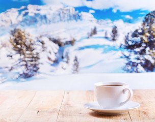 cup of coffee over winter landscape