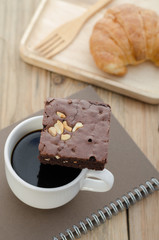 Concept at breakfast. Free time with notebook