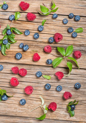 View from above of fresh berries on wooden table