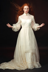 Portrait of the elegant woman in medieval era dress.