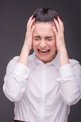 Naklejka premium Serious woman wearing white blouse