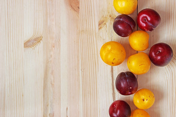 fresh plums on table