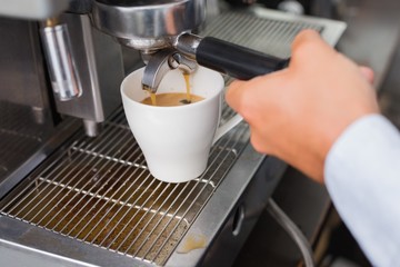 Barista making a cup of coffee