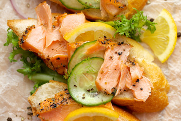 Sandwch with smoked salmon, fresh cucumber and  lemon
