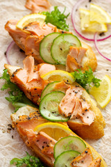 Sandwiches with smoked salmon, fresh cucumber and  lemon