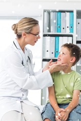 Obraz premium Composite image of doctor examining thyroid gland of boy