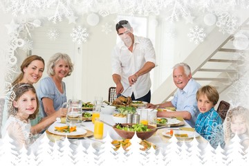 Composite image of smiling father serving meal to family