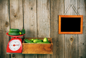 Cucumbers on scales and in a box