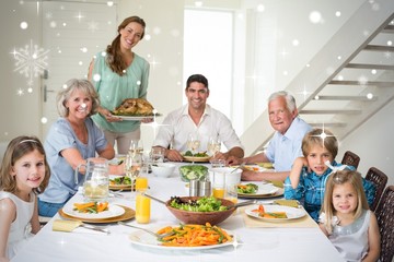 Composite image of family having meal at dining table