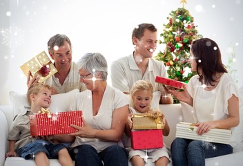 Happy family at home opening christmas presents