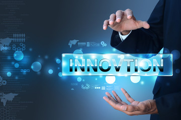 Man hand showing the word innovation