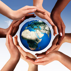 Multiracial hands making a circle together around the world glob - obrazy, fototapety, plakaty