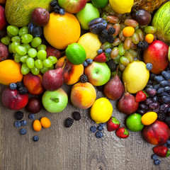 Organic Fruits  with water drops on dark wooden table