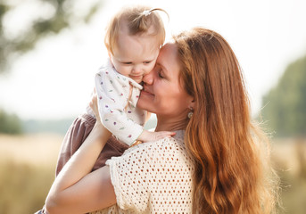 Portrait of happy mother and daughter outdoor