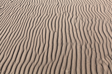 geometric patterns in sand at  beach