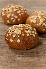 Whole grain wheat dinner rolls. Selective focus.
