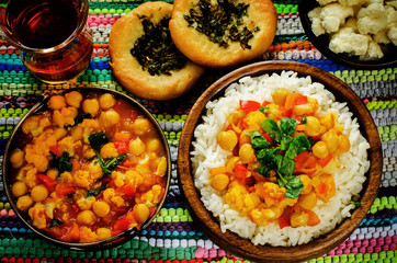 rice with curry chickpeas with vegetables and Arabic flat bread