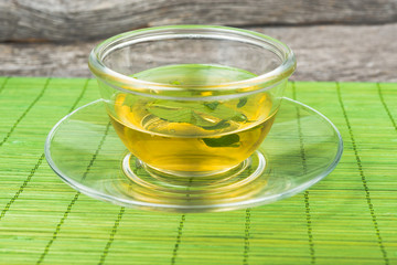 green  tea with mint  on cup of tea