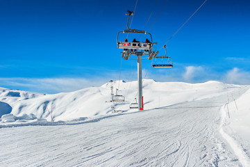 Fototapeta na wymiar Ski lift chairs in the Alps,La Toussuire,France,Europe