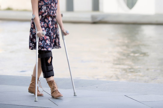 close up of woman with crutches