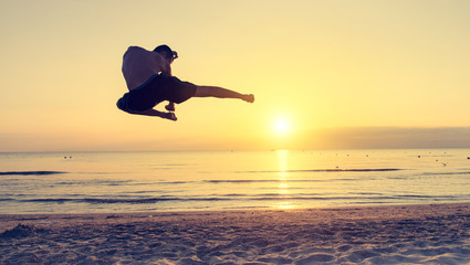 flying kick on the beach