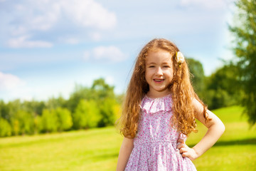 Fototapeta na wymiar Happy little girl in the park