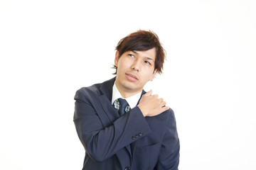 肩痛を訴えるビジネスマン