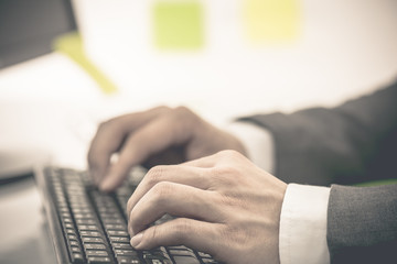 Businessman analyzing investment charts with computer. Accountin