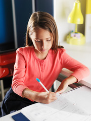 little girl doing home work for school