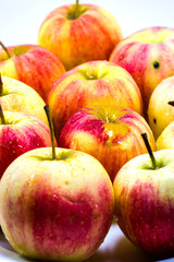Red apples on white background