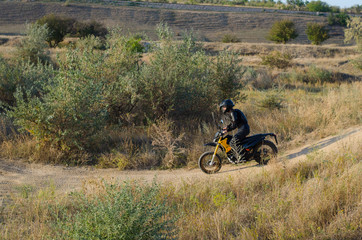 Rider on sport bike for enduro on motocross track