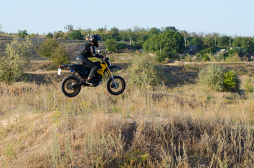 Fototapeta na wymiar Rider on sport bike for enduro on motocross track