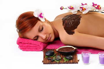 Obraz na płótnie Canvas Woman enjoying a chocolate beauty treatment at the health spa