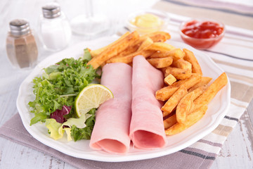 ham, french fries and salad
